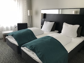 Standard Twin Room | Down comforters, desk, blackout drapes, iron/ironing board