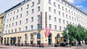 A multi-story hotel with a classic architectural style, featuring a prominent "HOTEL" sign on the facade. - Hotel Helka (Helsinki)