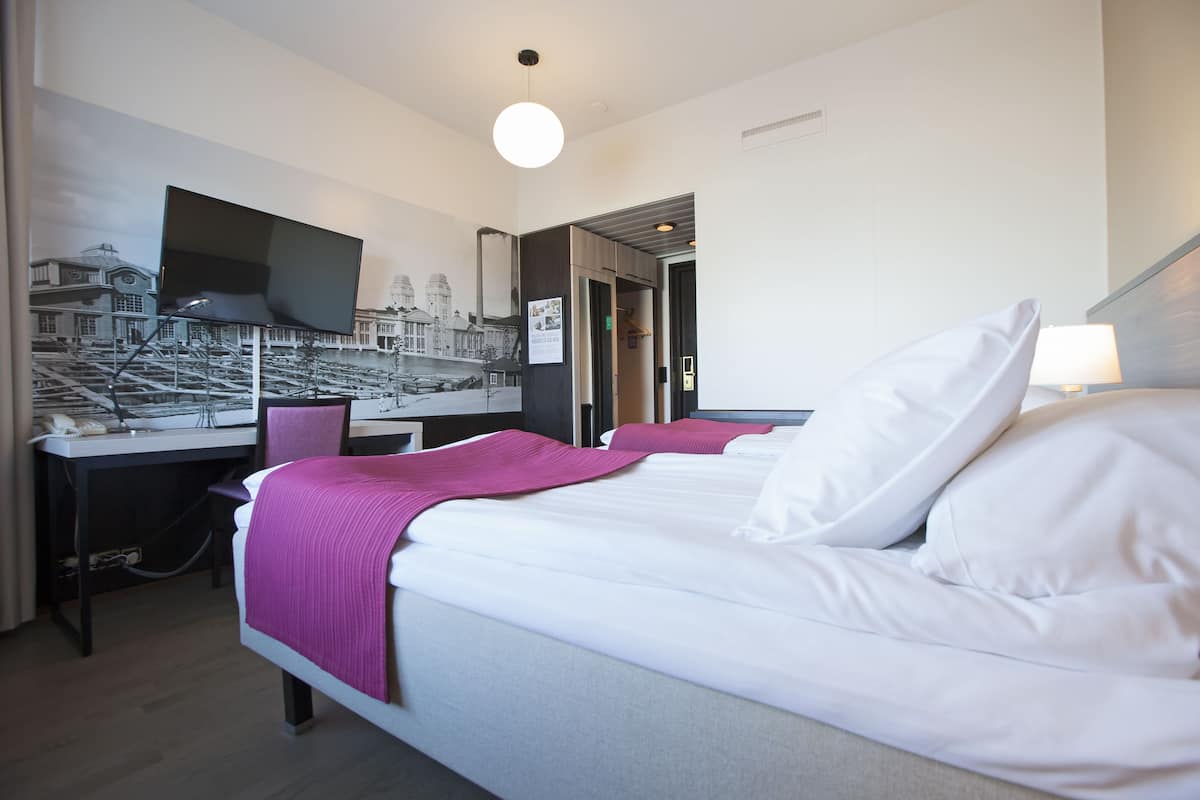 standard twin room | in-room safe, desk, laptop workspace, blackout curtains