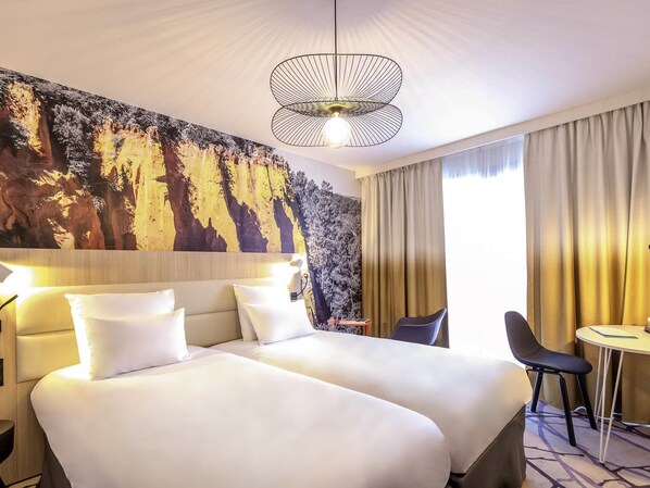 Luxe beddengoed, een minibar, een kluis op de kamer, een bureau