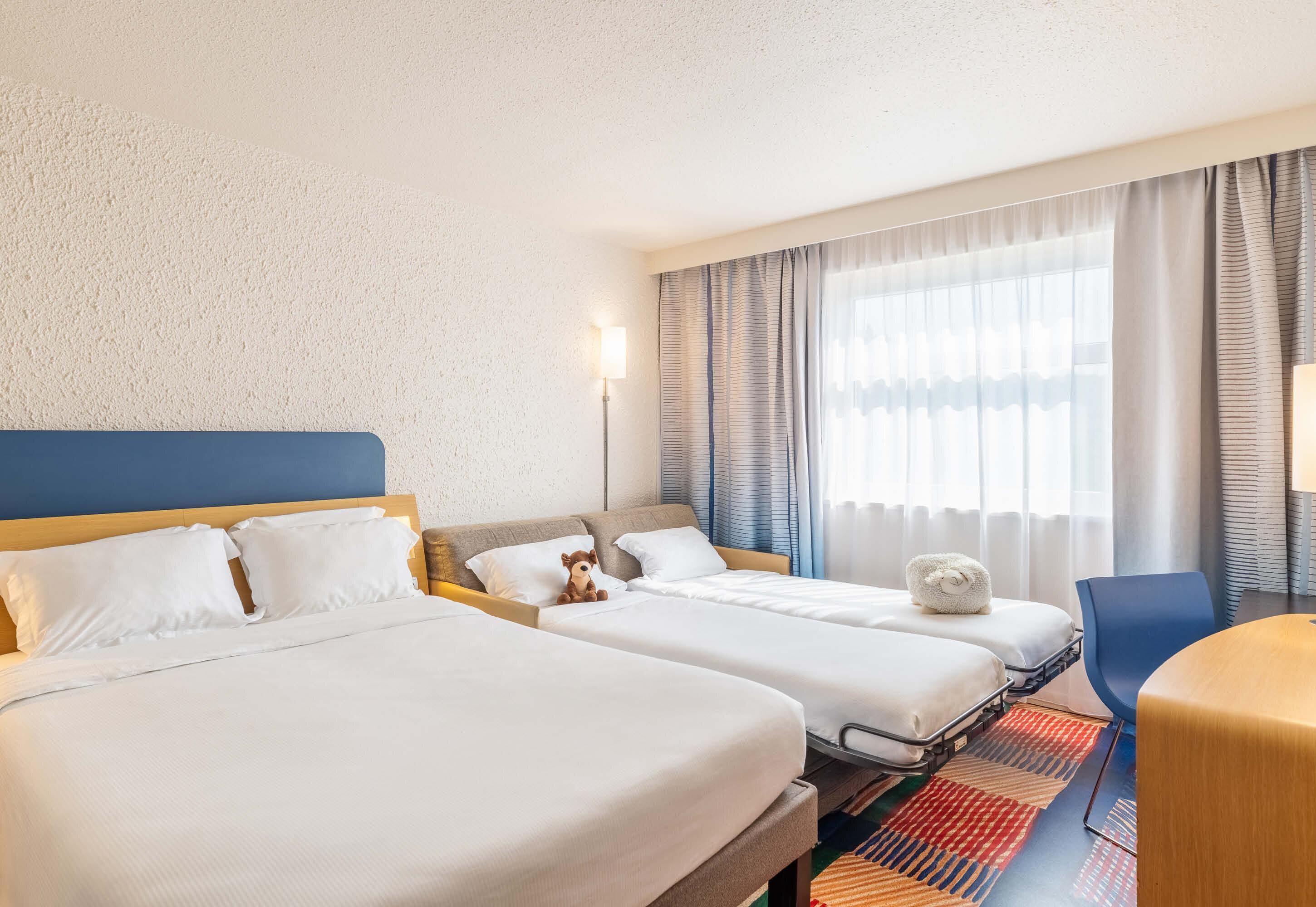 Premium bedding, memory-foam beds, in-room safe, desk