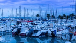 A marina filled with various boats, including sailboats and motorboats, docked closely together. - The Originals City, Hôtel Galaxie, Nice Aéroport (Saint-Laurent-du-Var)