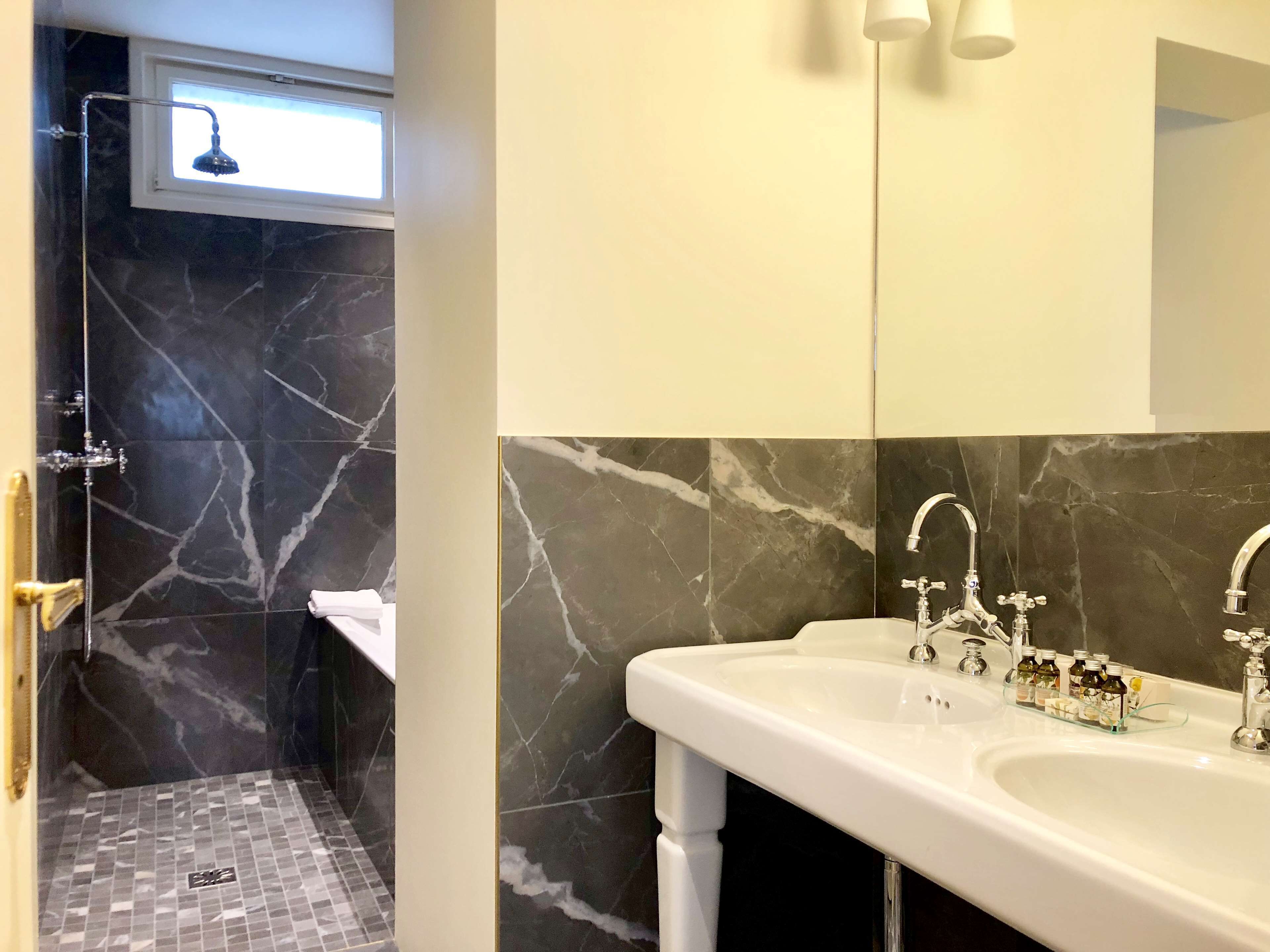 bathtub, free toiletries, hair dryer, towels