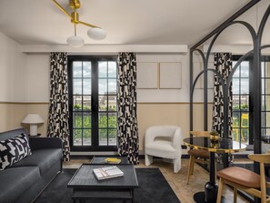 Junior Suite, Balcony, City View | Living area | 66-cm LCD TV with satellite channels, TV