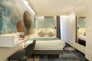A modern hotel room with a large bed, a bedside table, a chair, and a mirror. - Hotel Apolonia Paris Mouffetard, Sure Hotel Collection by BW (Paris)