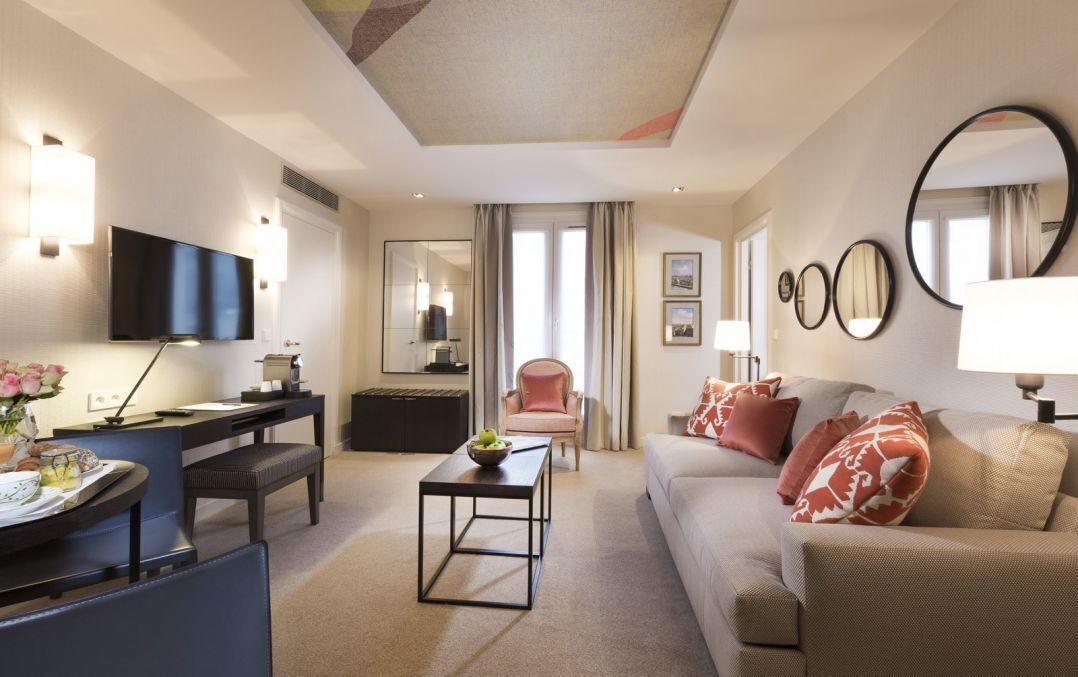 luxury suite, 1 queen bed, balcony | living area | 26-inch led tv with satellite channels, tv