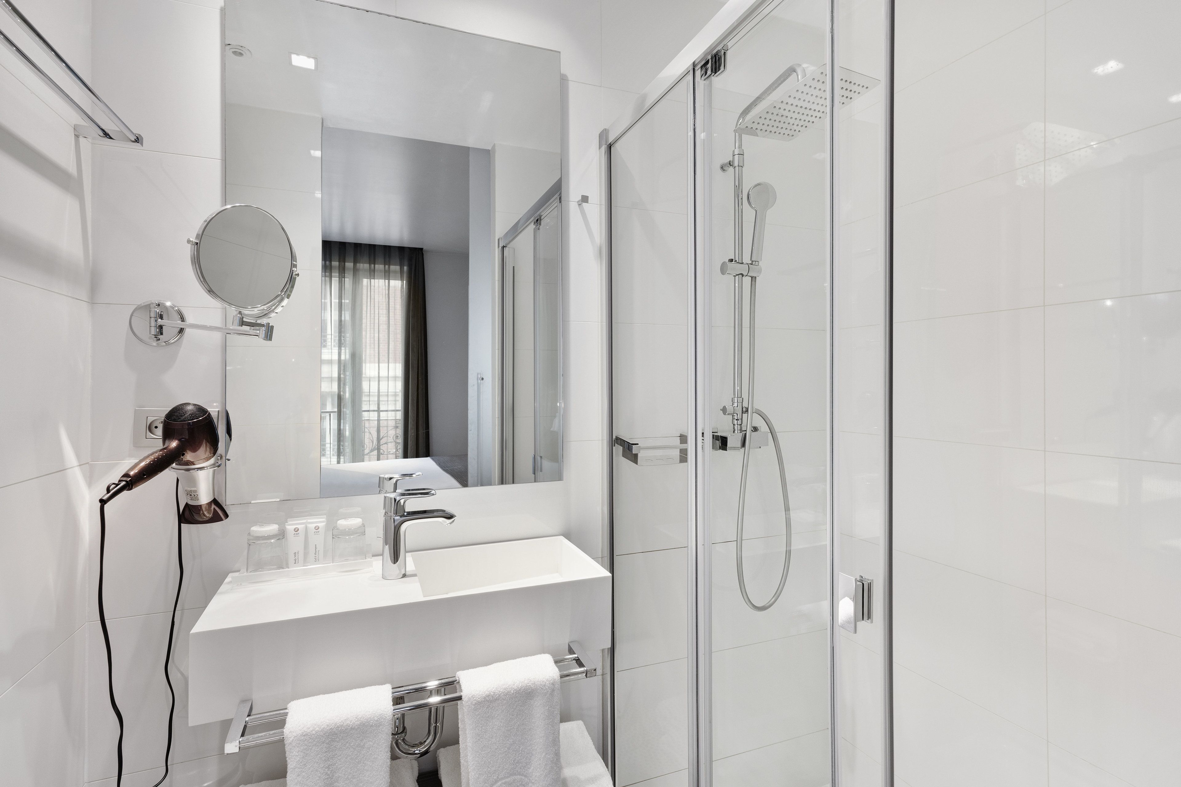 shower, designer toiletries, hair dryer, towels