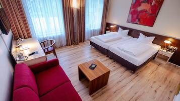 Comfort Double Room, 1 Double or 2 Twin Beds | Living area | TV