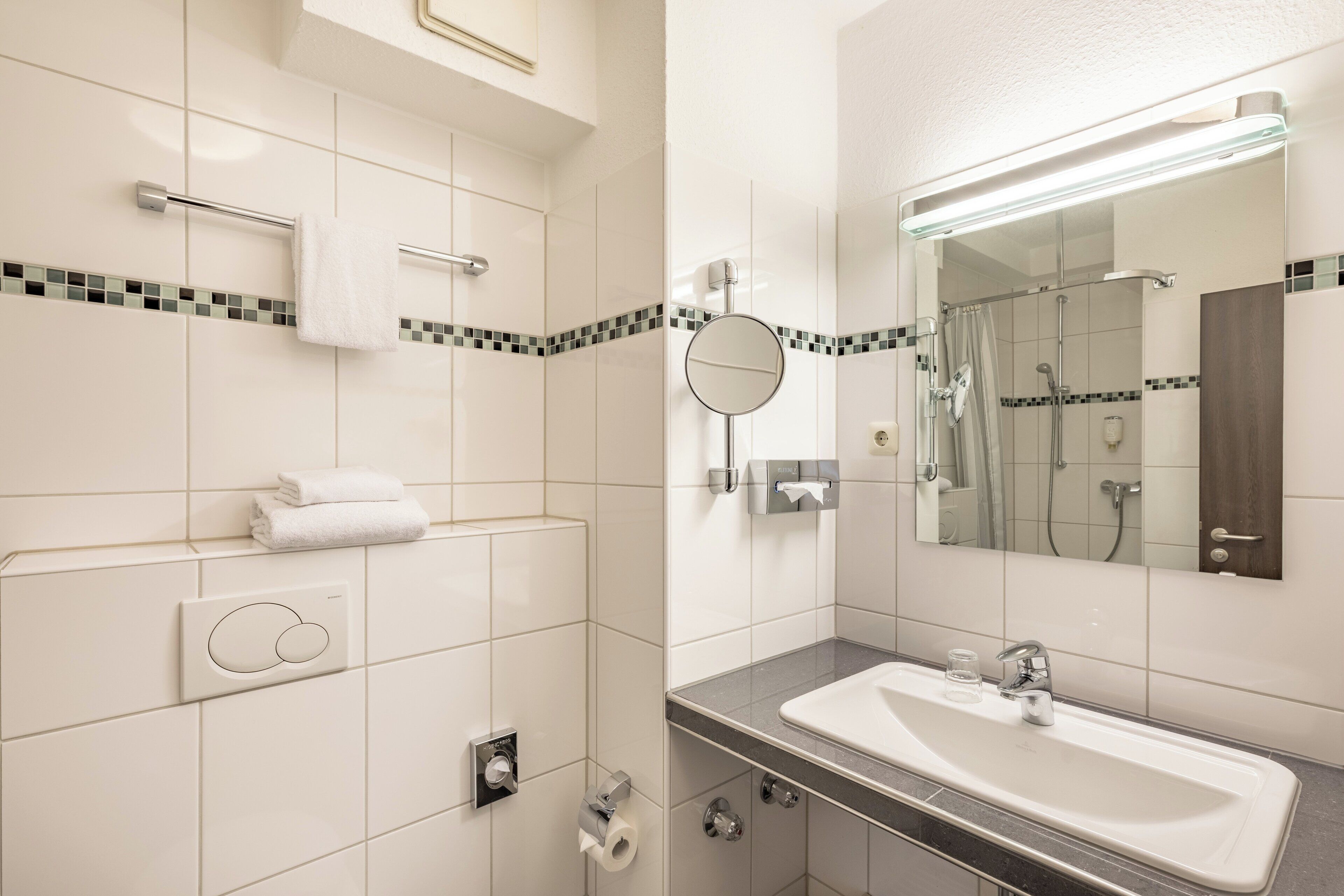 Shower, hair dryer, towels