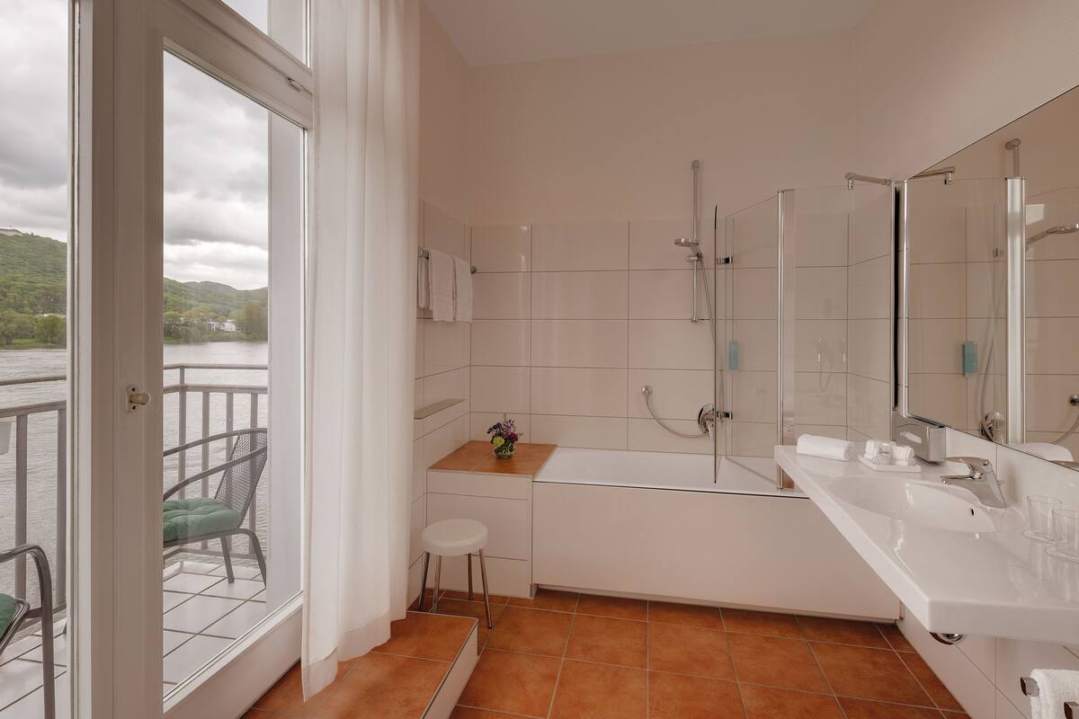 eco-friendly toiletries, hair dryer, slippers, towels