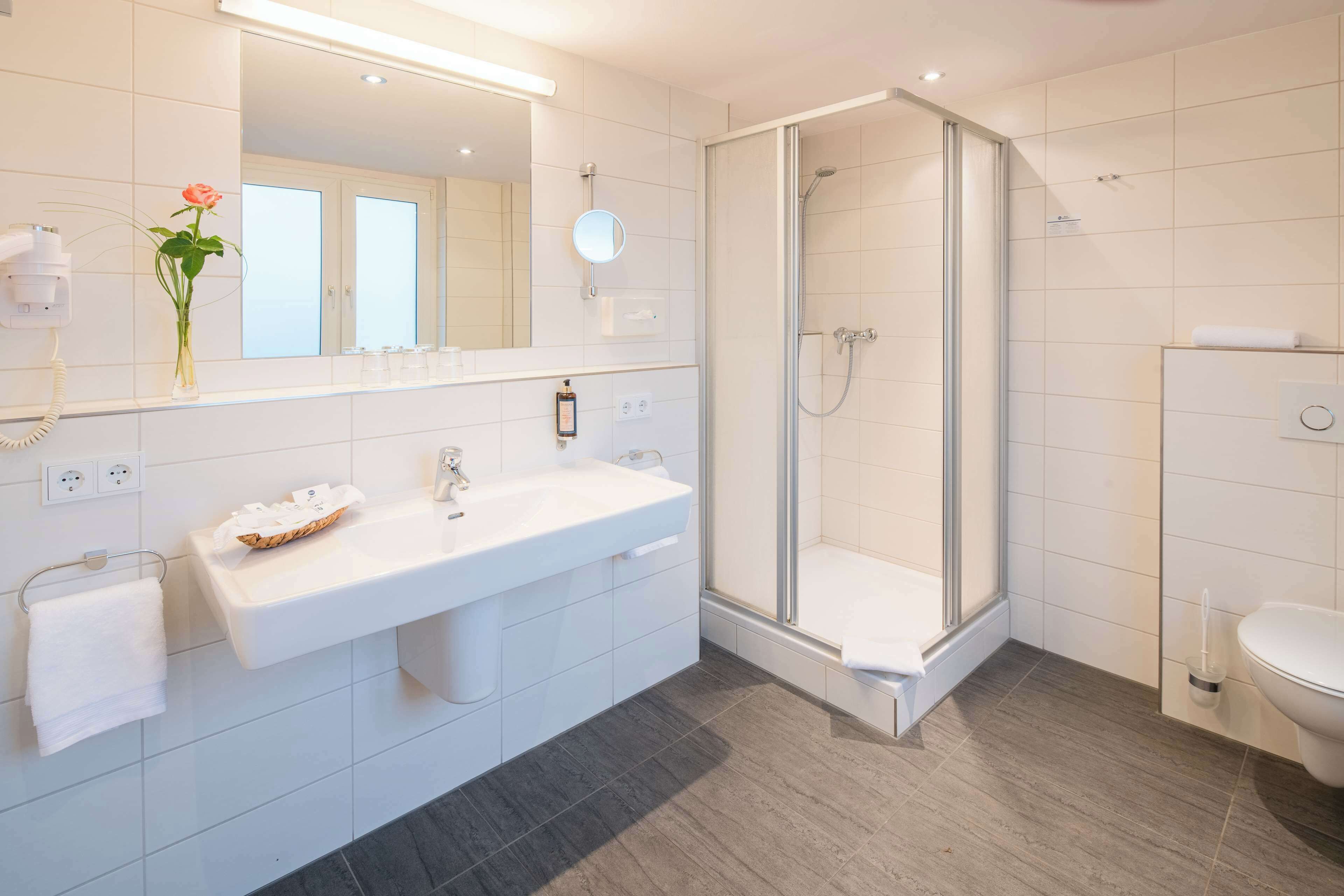 family room, 3 single beds | bathroom | free toiletries, hair dryer, towels