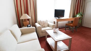 Premium bedding, desk, laptop workspace, blackout drapes