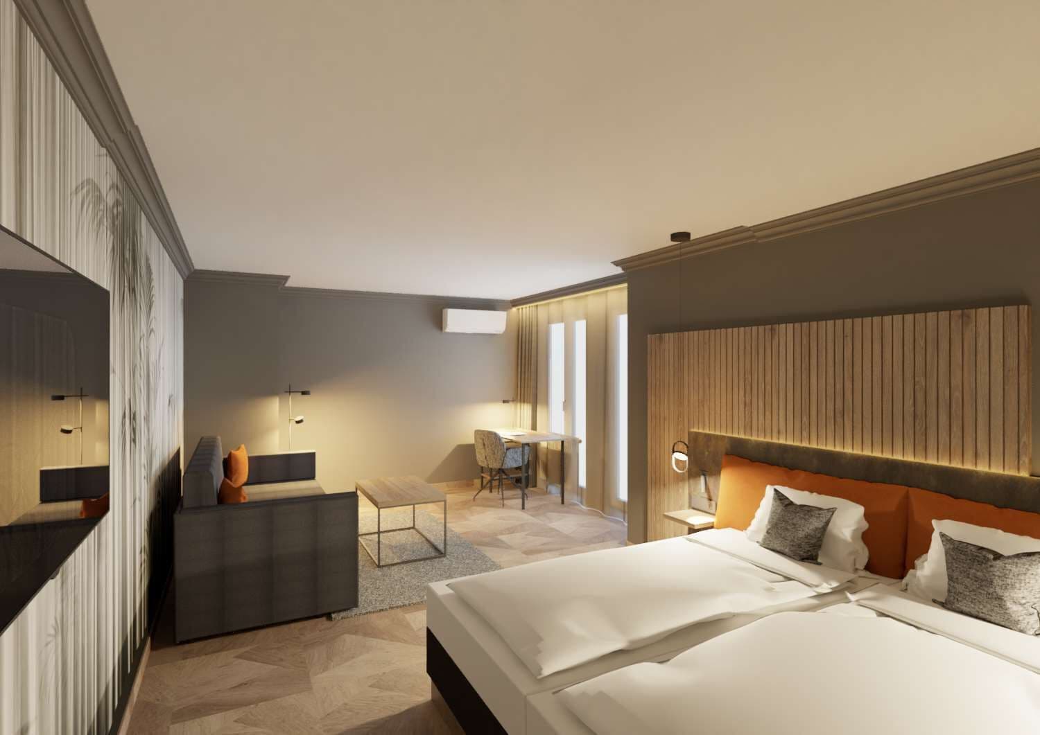 Ein modernes Hotelzimmer mit einem großen Bett, einem Schreibtisch und einer Sitzecke.