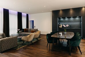 Luxury Suite Waldblick | Living area | 31-inch flat-screen TV with satellite channels