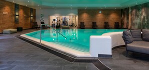 Indoor pool, open 7:00 AM to 10:00 PM, pool loungers