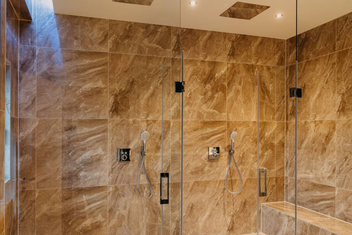 luxury suite waldblick | bathroom | shower, rainfall showerhead, designer toiletries, hair dryer