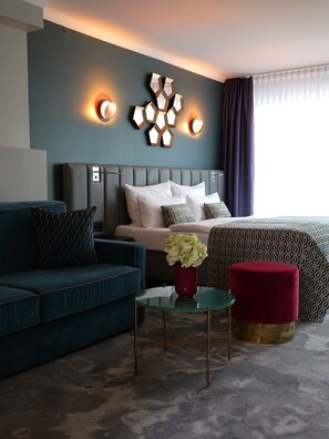 Deluxe Quadruple Room | Minibar, in-room safe, individually furnished, desk