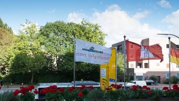 A hotel sign with "Hotel Helgoland" and a flag.