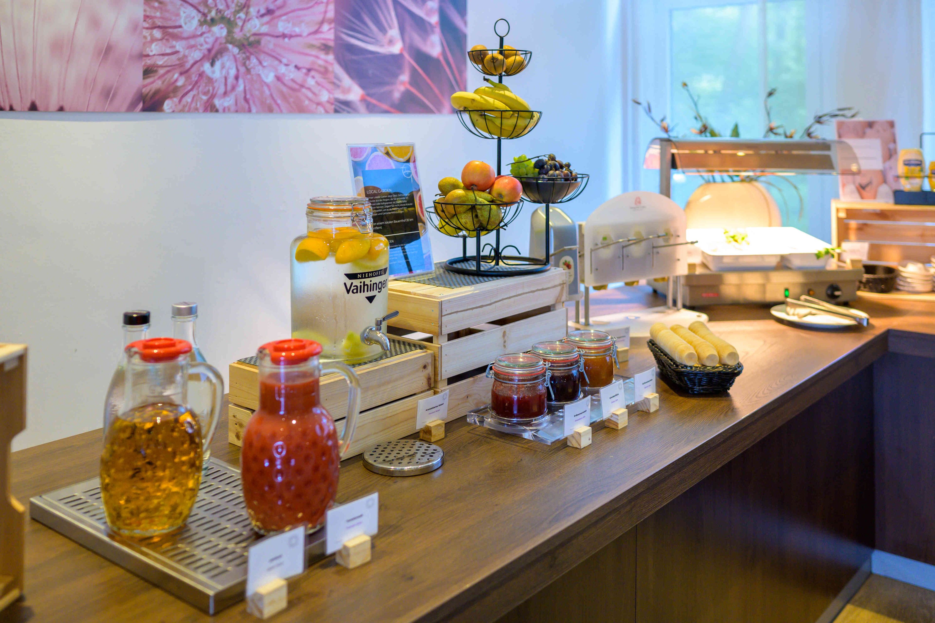 A breakfast buffet with various food items and condiments.
