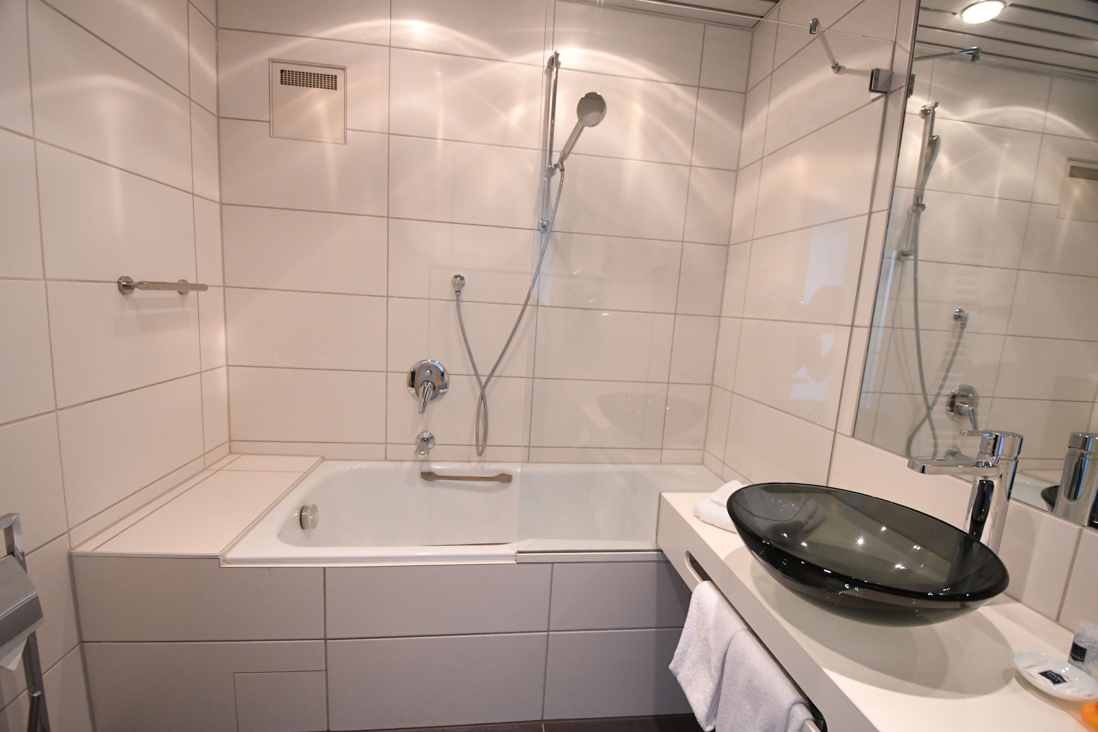 hair dryer, bathrobes, slippers, towels