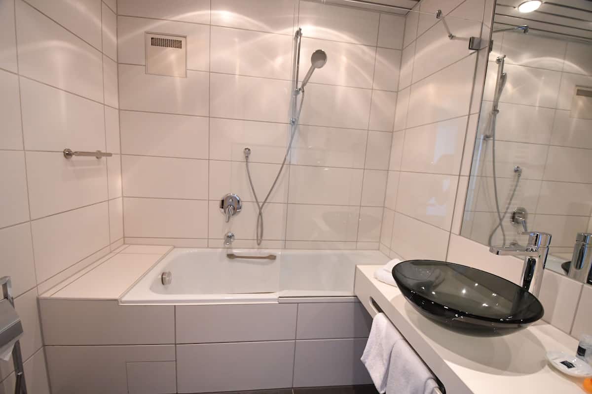 hair dryer, bathrobes, slippers, towels