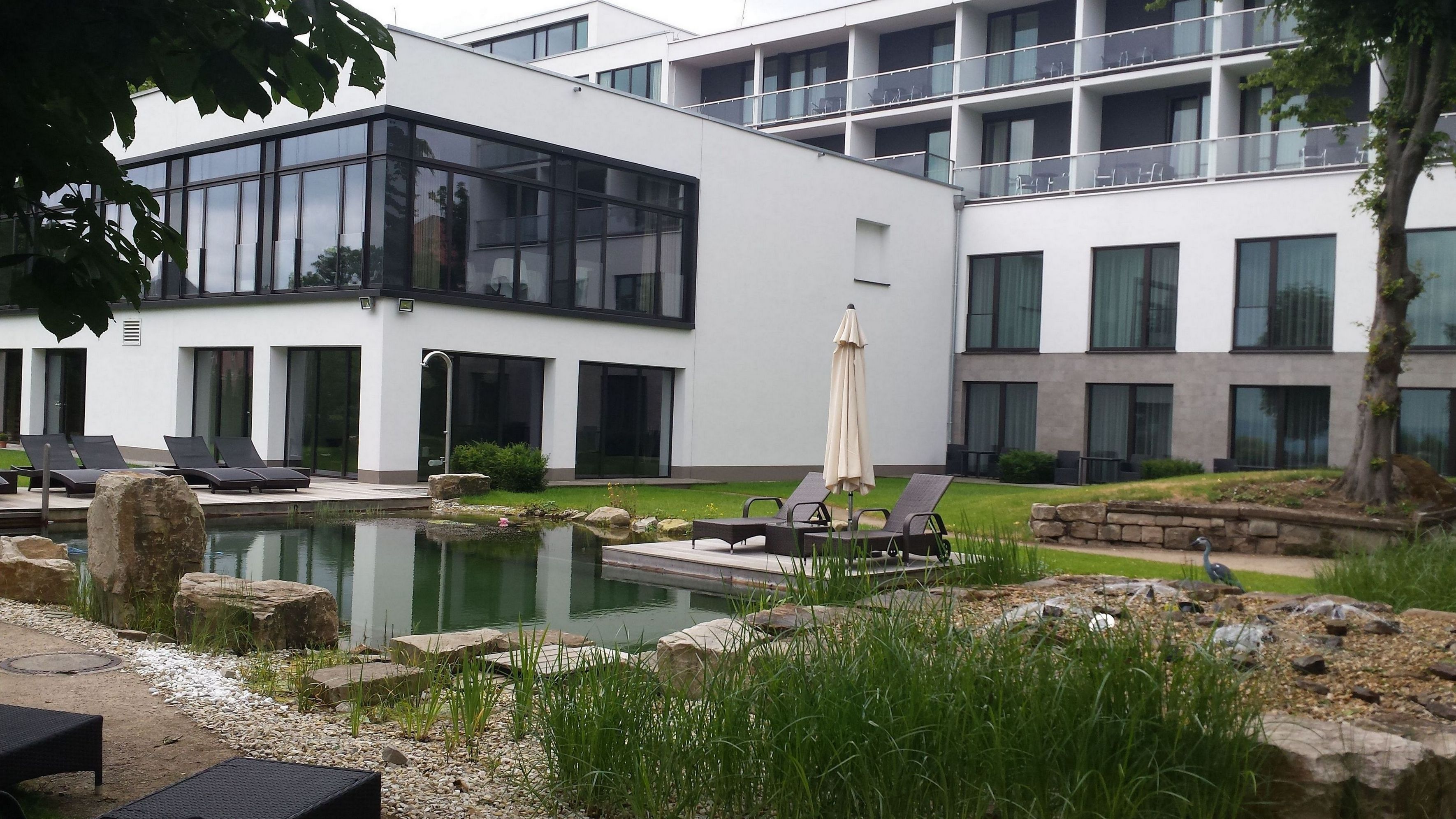 indoor pool, outdoor pool, pool umbrellas, pool loungers