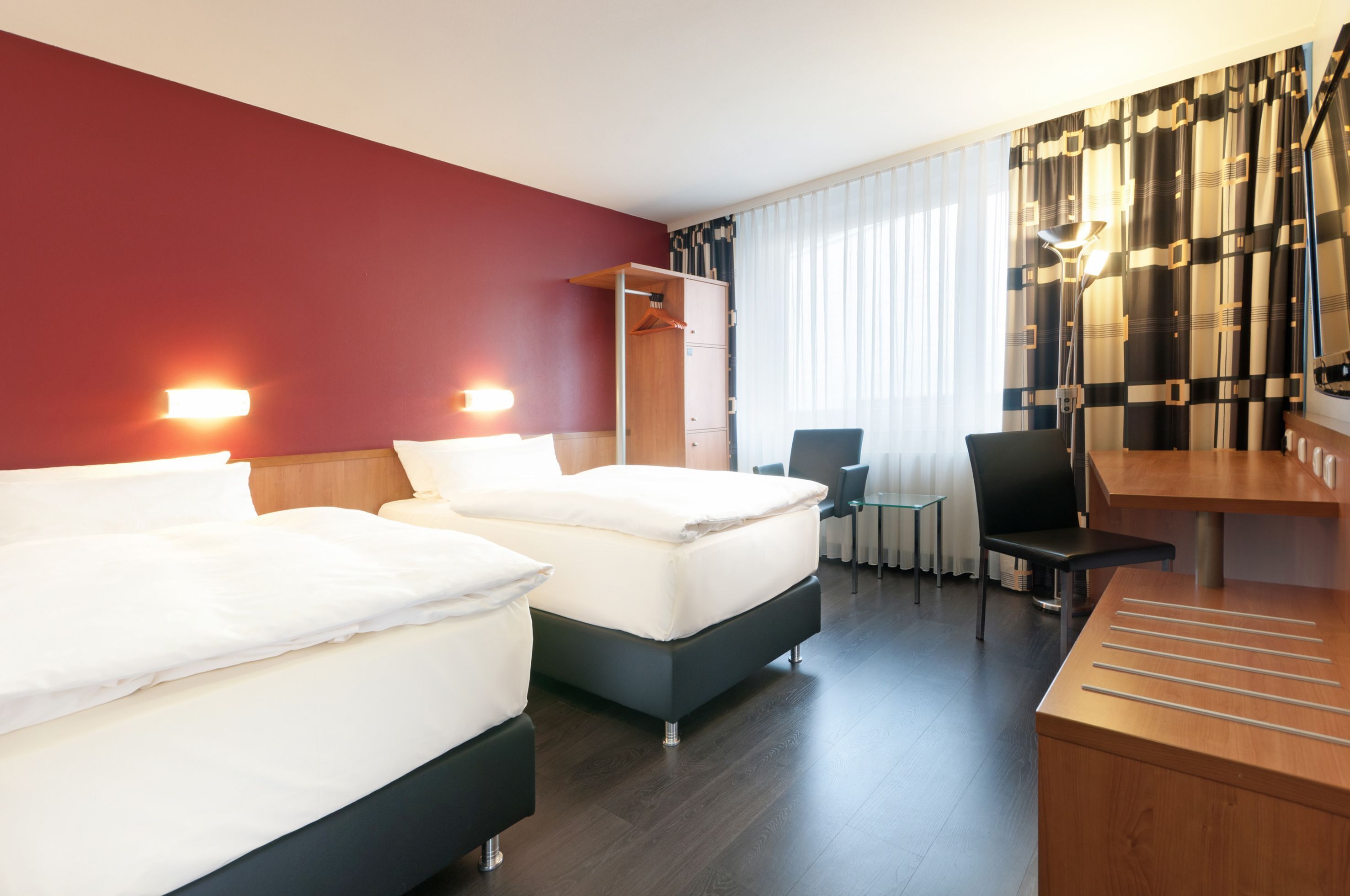 Premium bedding, pillowtop beds, desk, blackout drapes