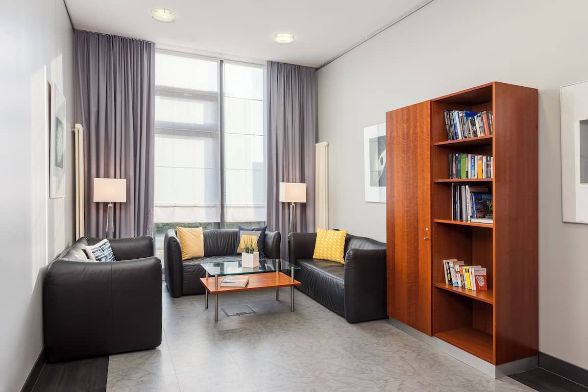 premium bedding, pillow-top beds, desk, blackout curtains