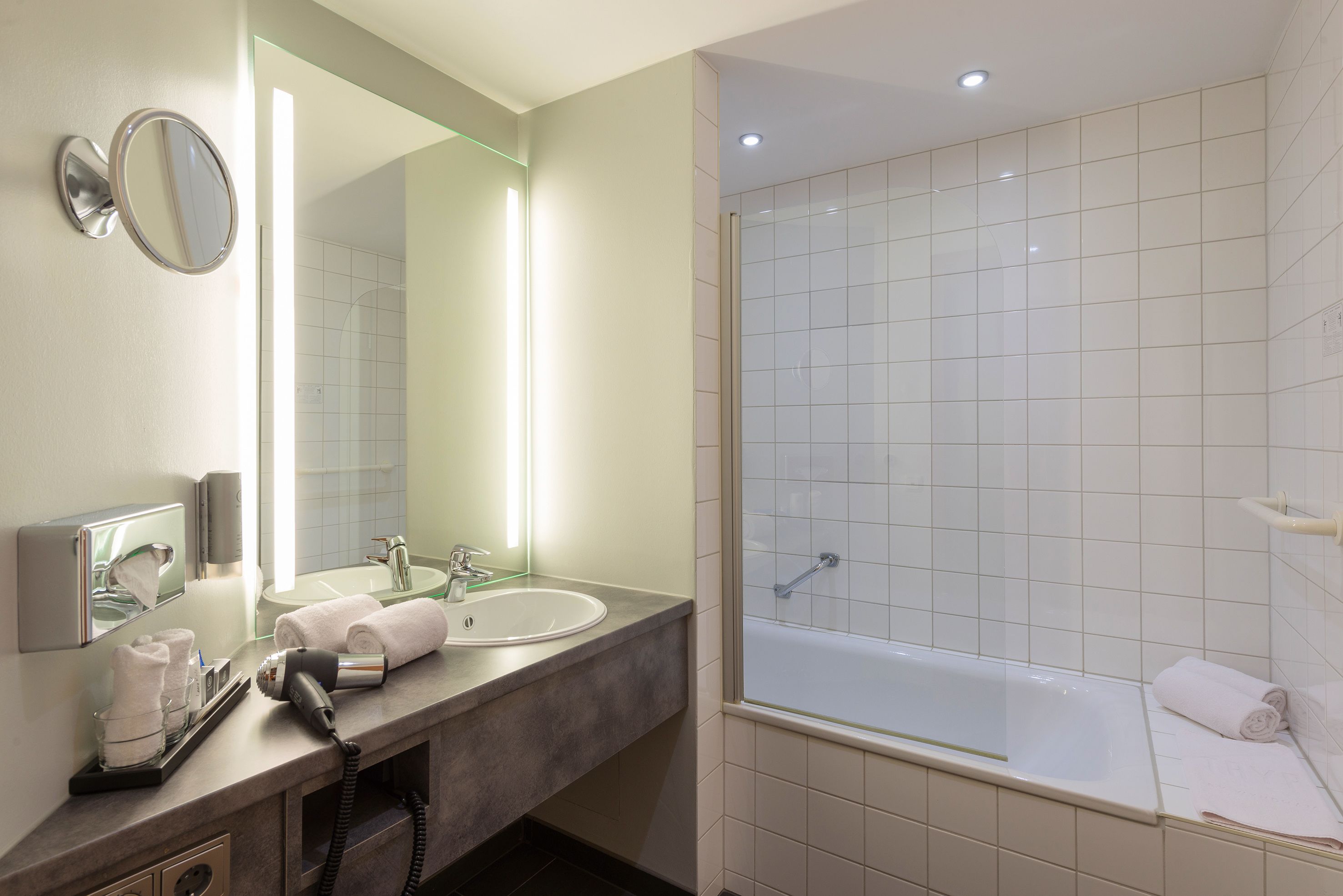 junior suite | bathroom | shower, free toiletries, hair dryer, bathrobes