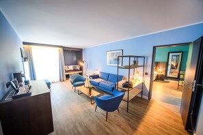 Suite, Multiple Beds | Living area | 42-inch LED TV with satellite channels, TV