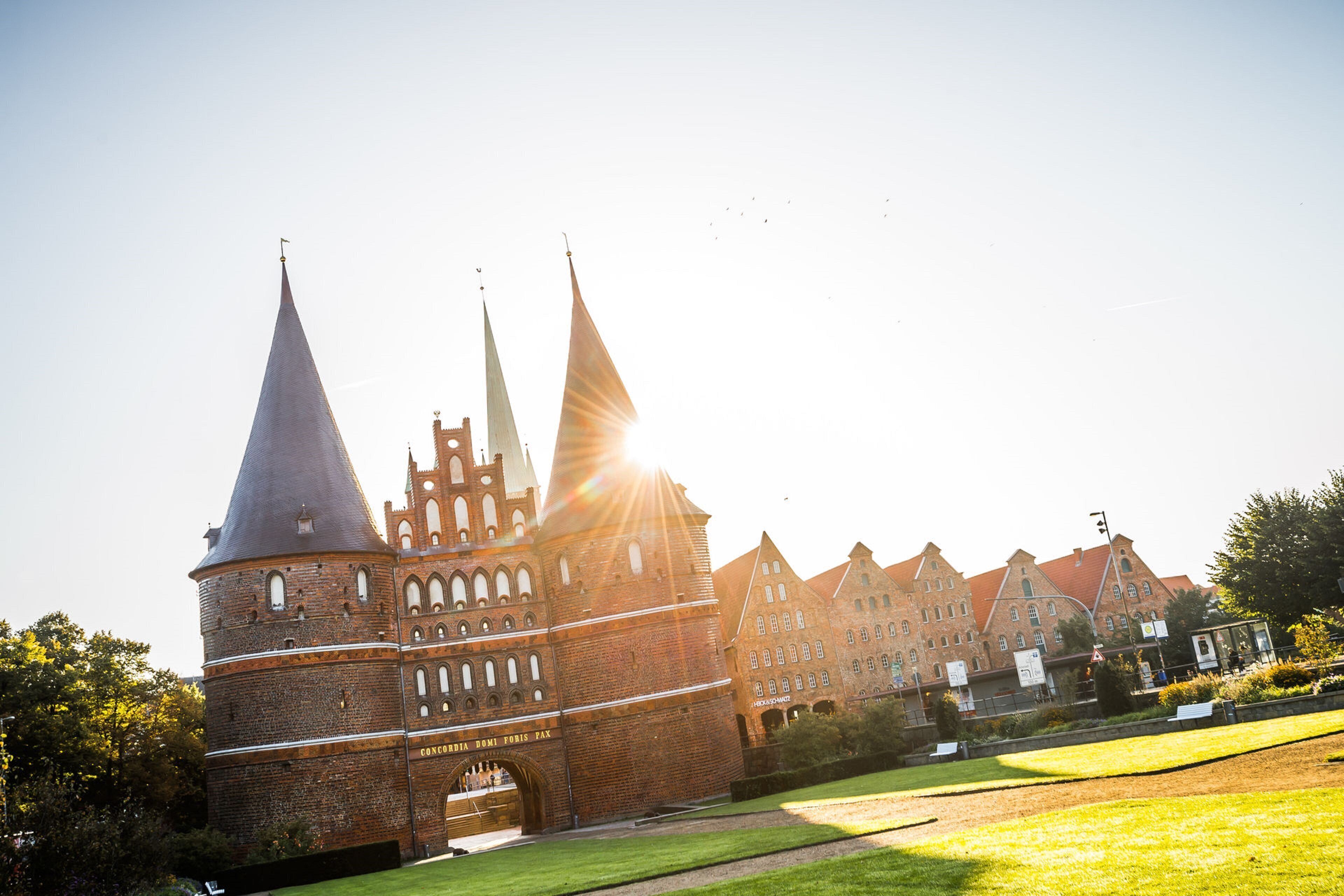 A historic building with multiple spires and a prominent entrance.