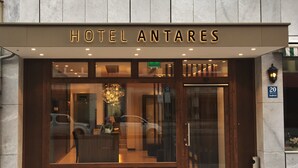 The exterior of Hotel Antares with a modern facade, large glass windows, and a prominent entrance. - Hotel Antares (Munich)