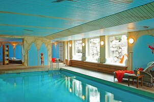 Indoor pool, open 6:00 AM to 10:00 PM, pool loungers