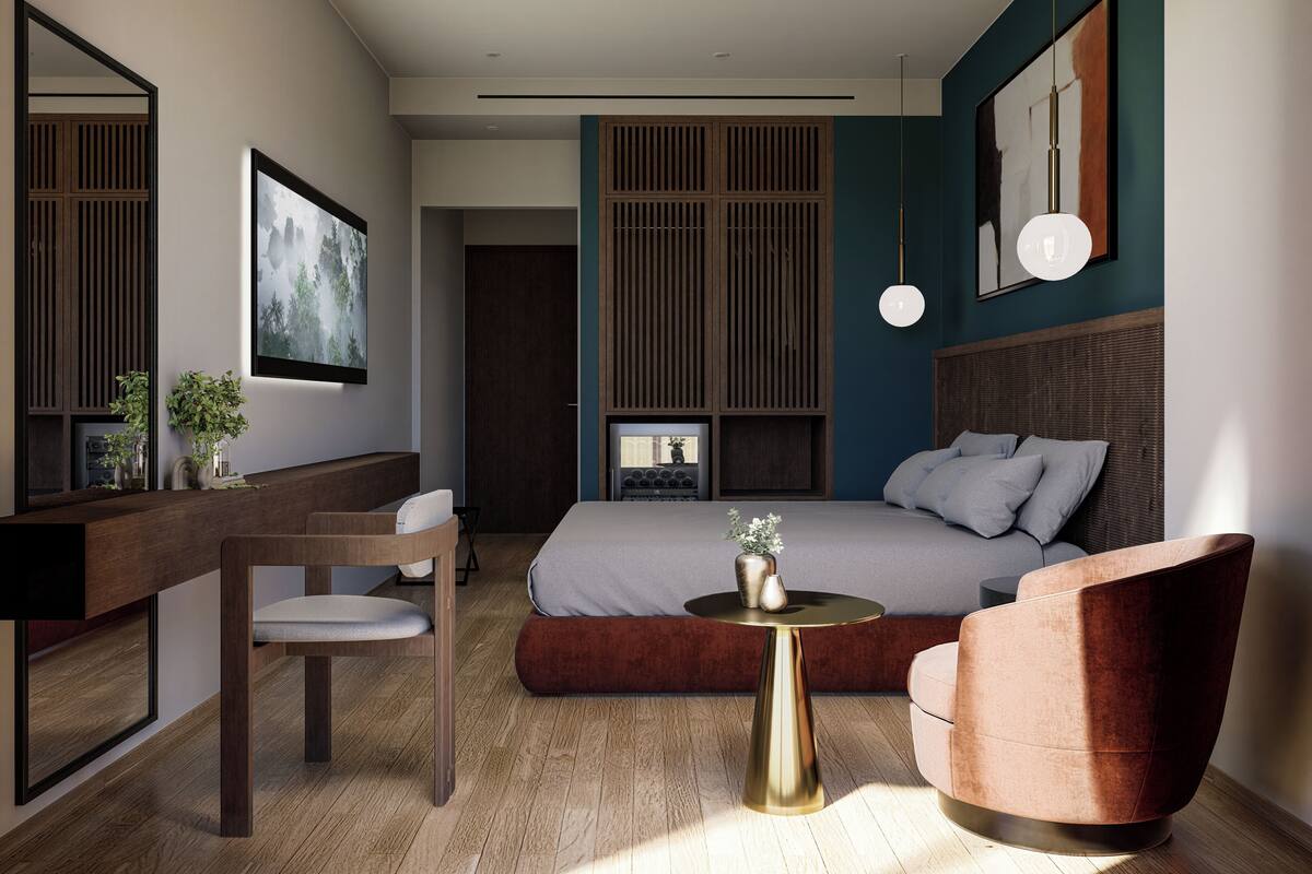 A modern hotel room with a bed, a desk, a chair, a round table, and a large mirror.