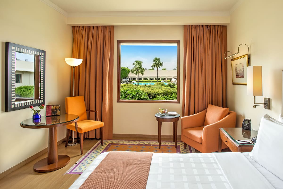 deluxe room, pool view | view from room