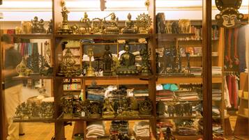 A store with shelves of various statues and religious artifacts.