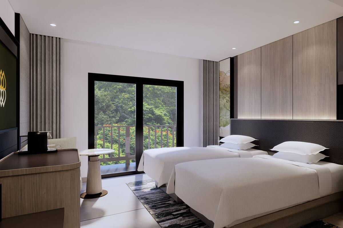 A modern hotel room with two beds, a desk, a large window with a view of greenery, and a painting on the wall.
