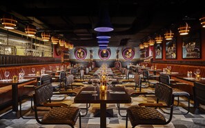 Enjoy a formal dining experience with fine china, leather-upholstered chairs, and elegant ambiance.
