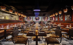 Enjoy a formal dining experience with fine china, leather-upholstered chairs, and elegant ambiance.