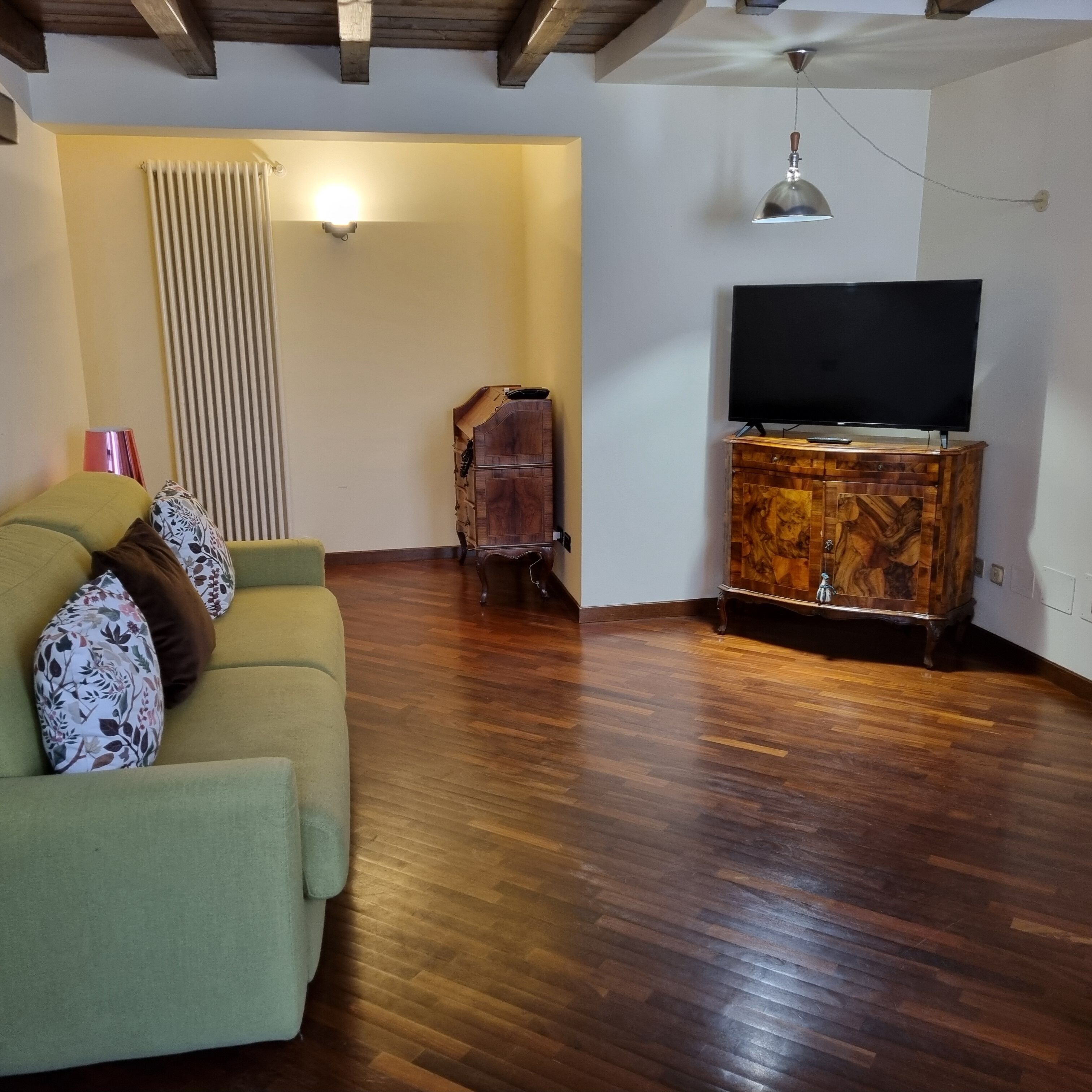 la loggia apartment | living area | flat-screen tv