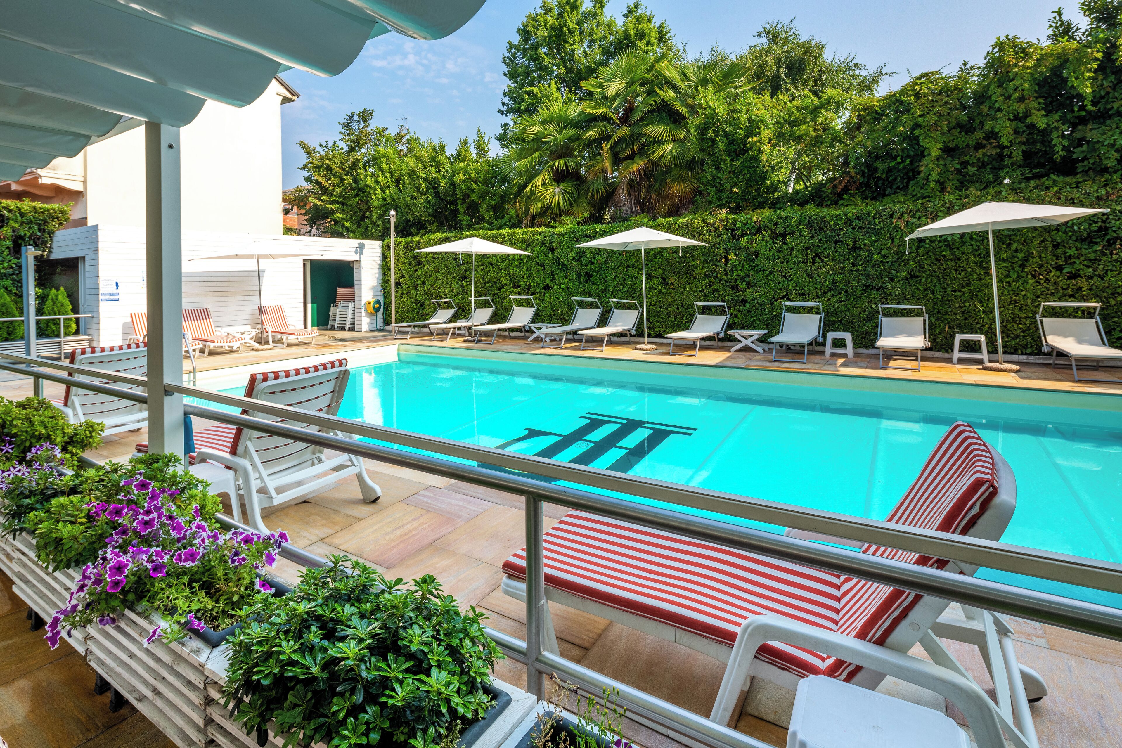 Seasonal outdoor pool, pool umbrellas, sun loungers