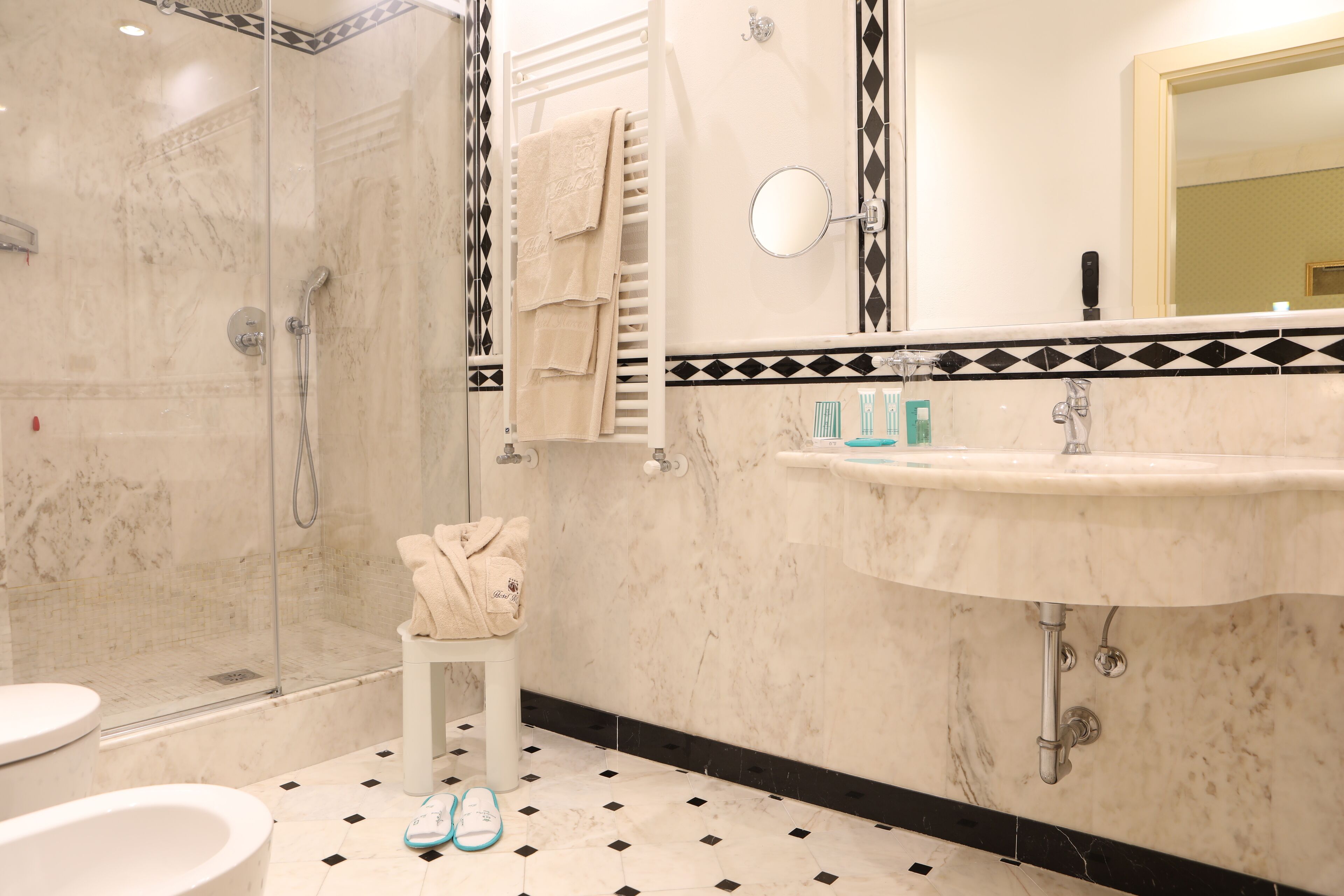 deluxe triple room | bathroom | hair dryer, slippers, bidet, towels