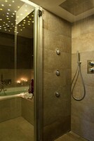 Suite, Jetted Tub | Bathroom | Rainfall showerhead, free toiletries, hair dryer, bidet
