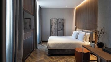 Premium Double Room, Courtyard View | Minibar, in-room safe, laptop workspace, iron/ironing board
