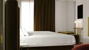 A modern hotel room with a large bed, a bedside table, a lamp, and a view of the outdoors.