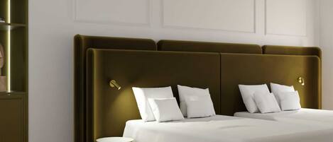 A modern bedroom with a large bed, a bedside table, and a wall-mounted light fixture.