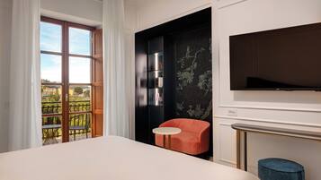 Habitación Confort, vista al jardín | Ropa de cama de alta calidad y minibar
