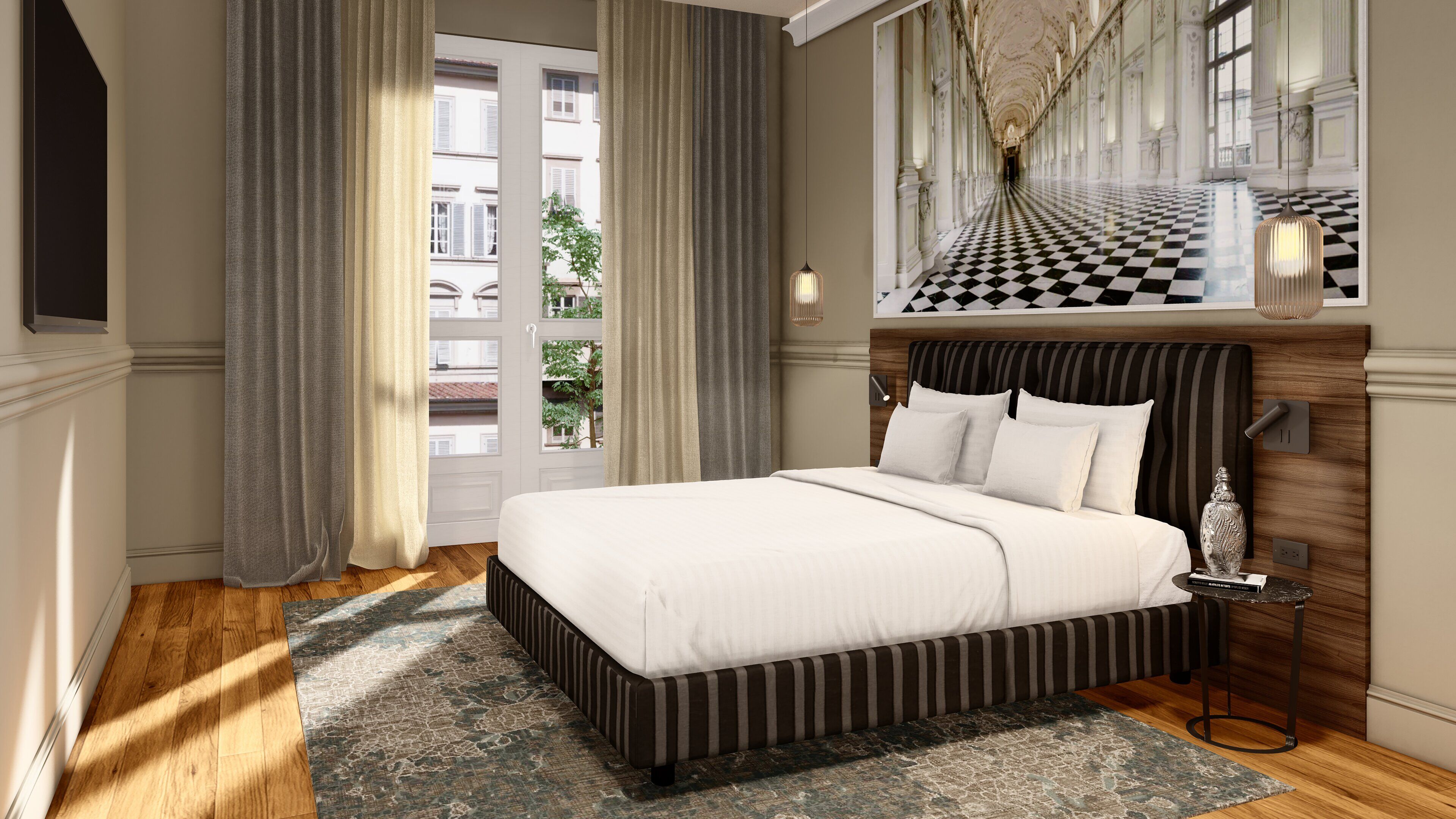 Habitación de hotel con una cama grande, vista a la ciudad y un candelabro.
