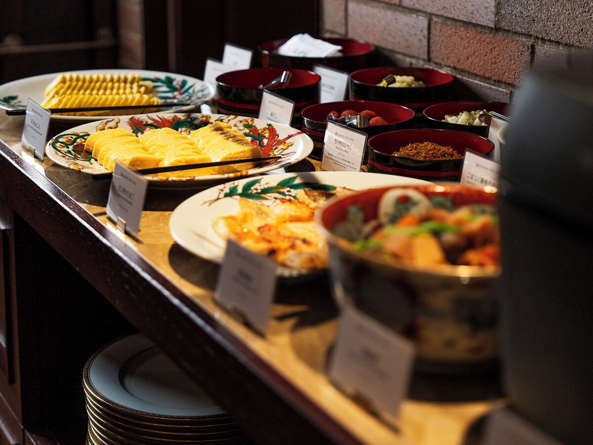 A buffet with various dishes and labels.