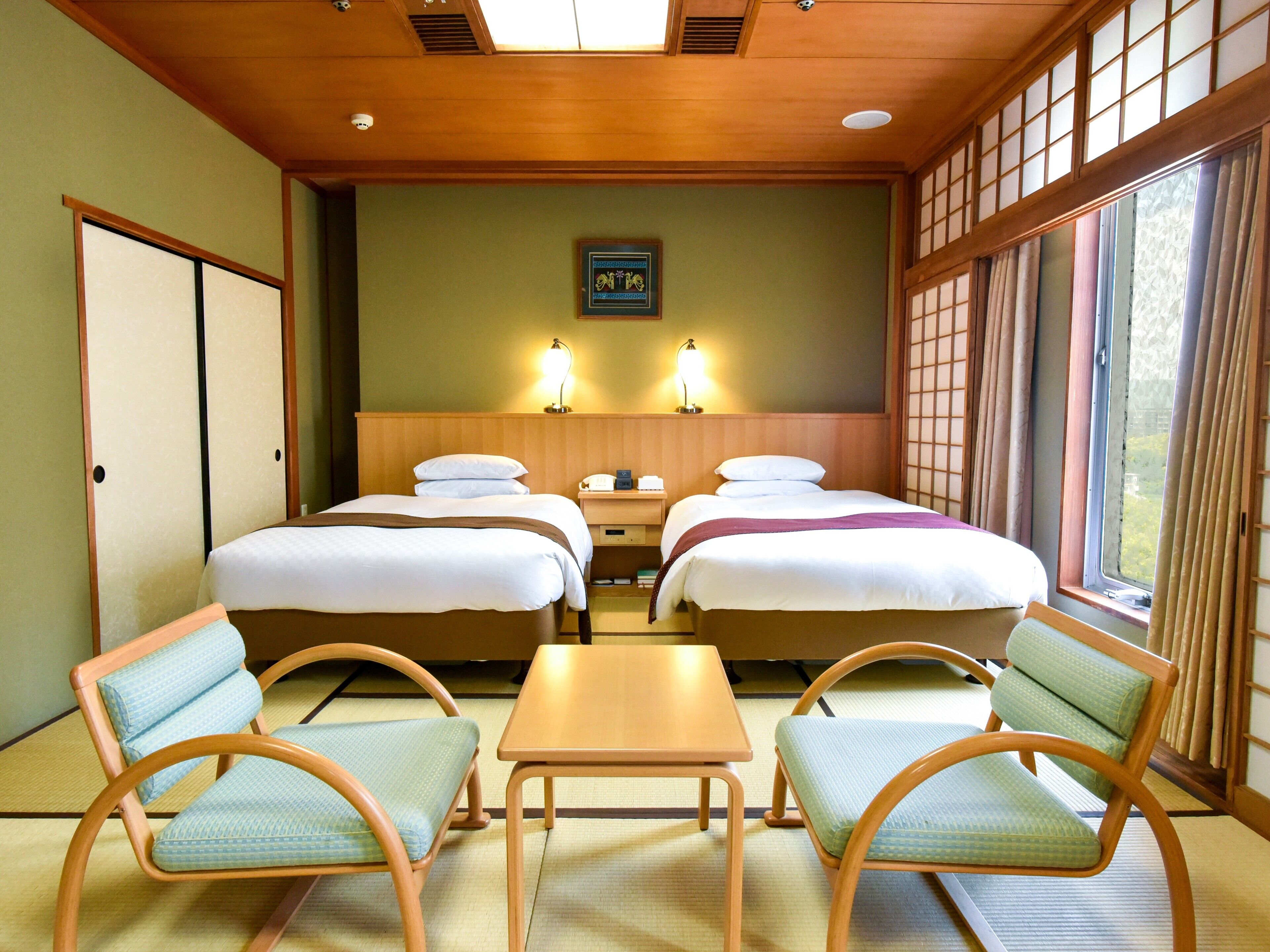 traditional twin room, non smoking, city view (japanese western) | in-room safe, individually decorated, individually furnished, desk